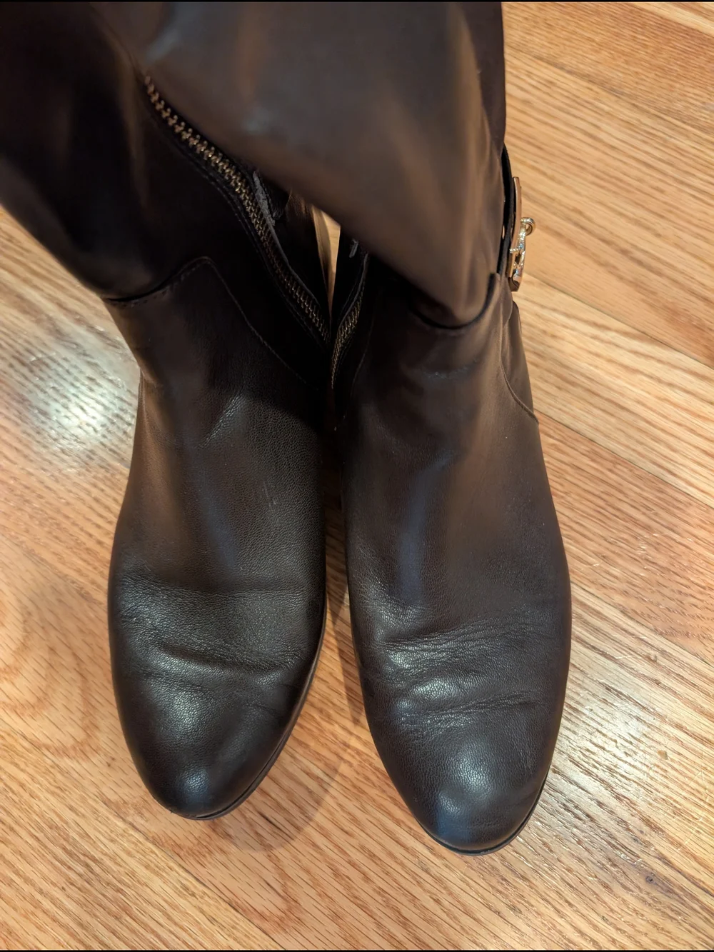 Black Leather Knee-High Boots with Gold Accent